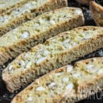 slices of baked dried out biscotti on a cookie sheet