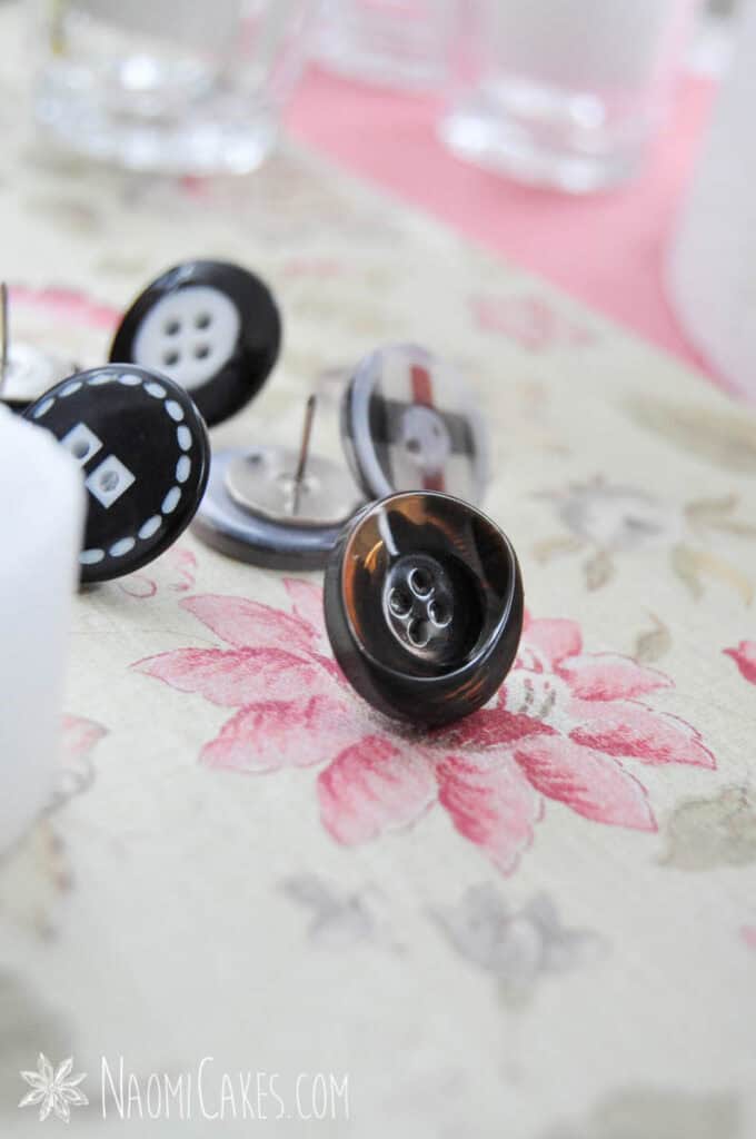 button thumb tacks on floral paper