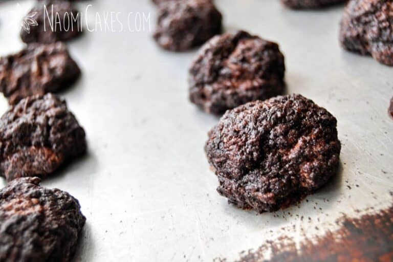 horizontal image, baked chocolate spice cookies on a cookie sheet