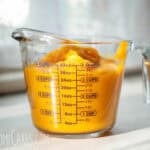 a 4 cup measuring pitcher with homemade pumpkin puree