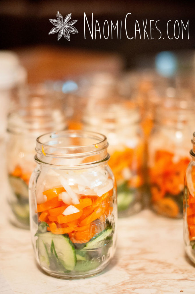 fresh vegetables stuffed into pint jars