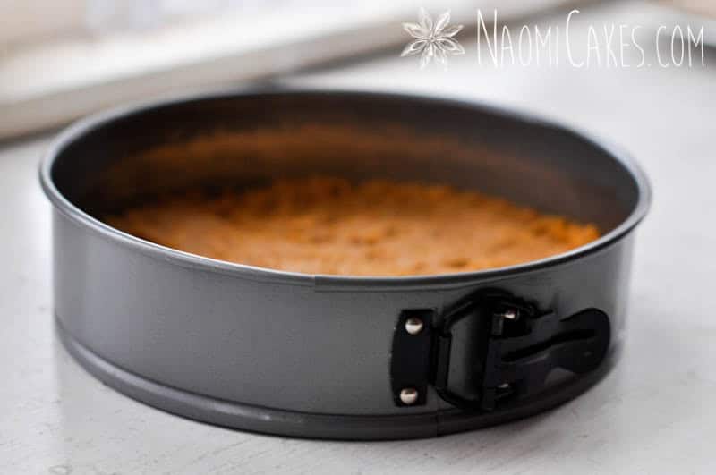 springform pan with cheesecake crust pressed into the base