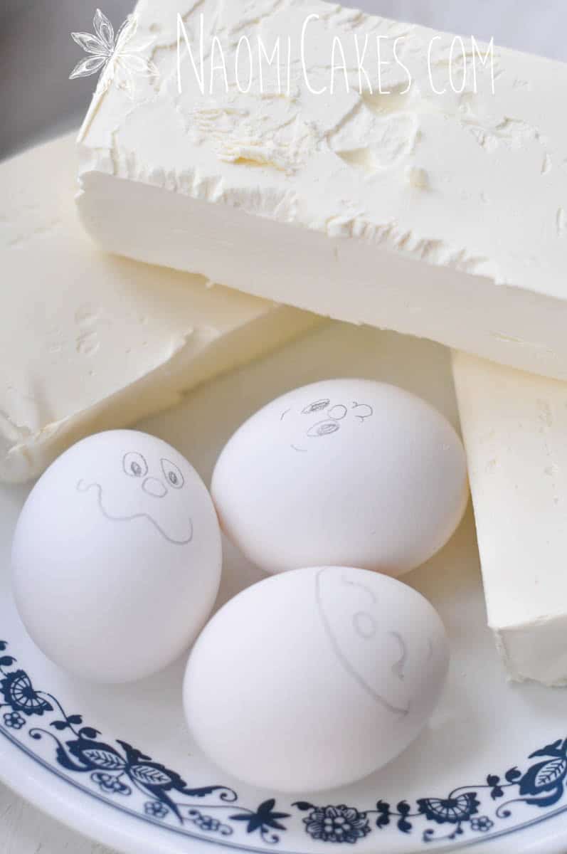 cream cheese and 3 eggs with faces on them