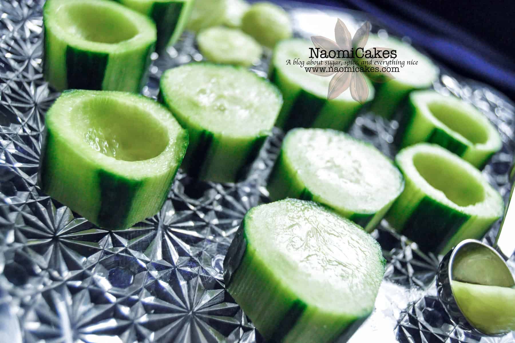 hollowed out cucumber chunks on a plate