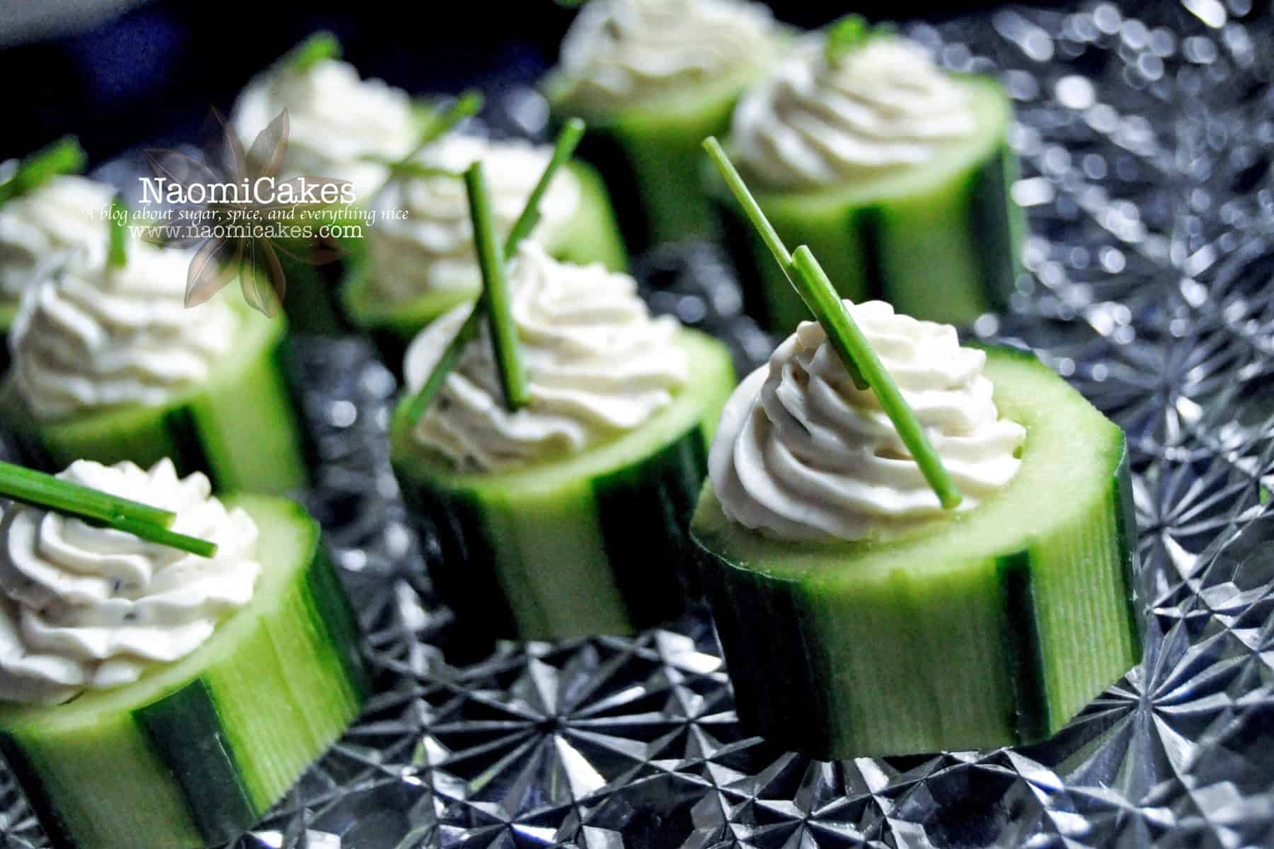 horizontal view of cucumber appetizers on a platter