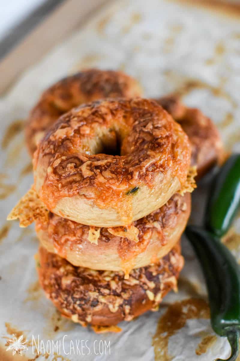 a stack of cheesy jalapeno cheddar bagels