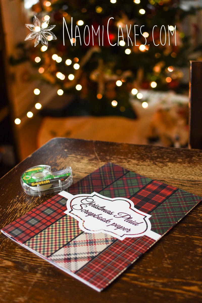 plaid Christmas craft paper on a wooden table with scotch tape