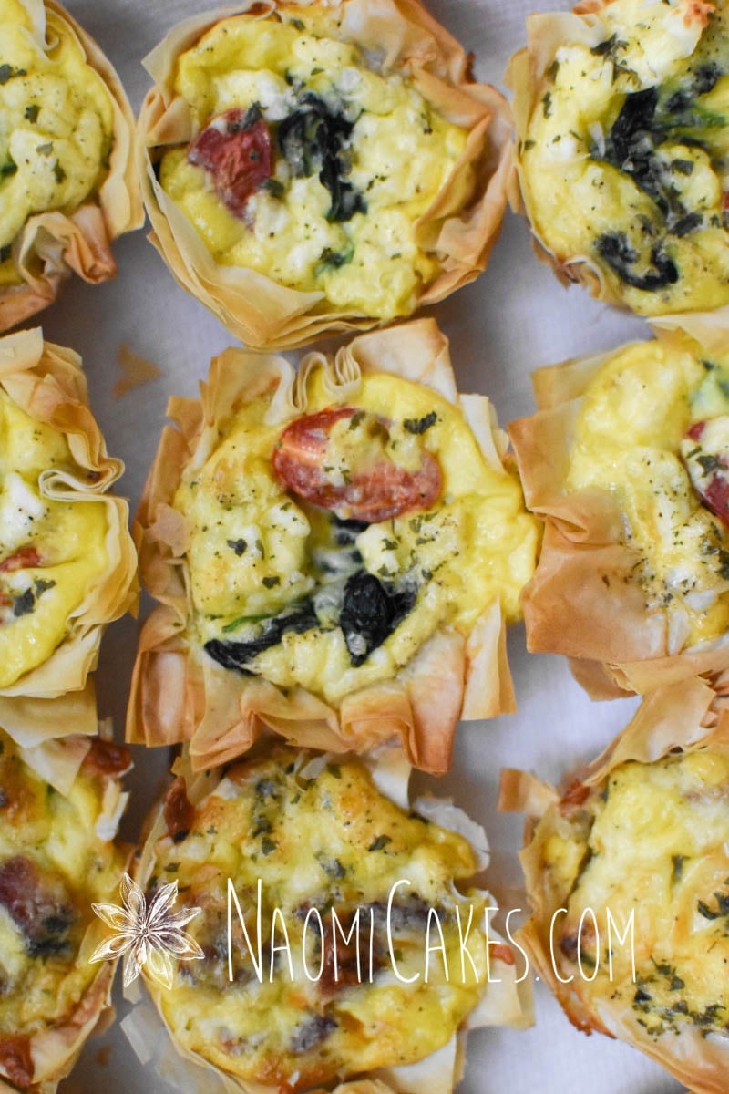 miniature quiche with spinach, tomato and feta cheese