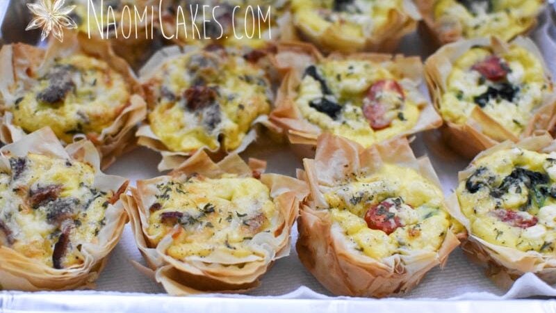 egg tarts in a pan with parchment paper