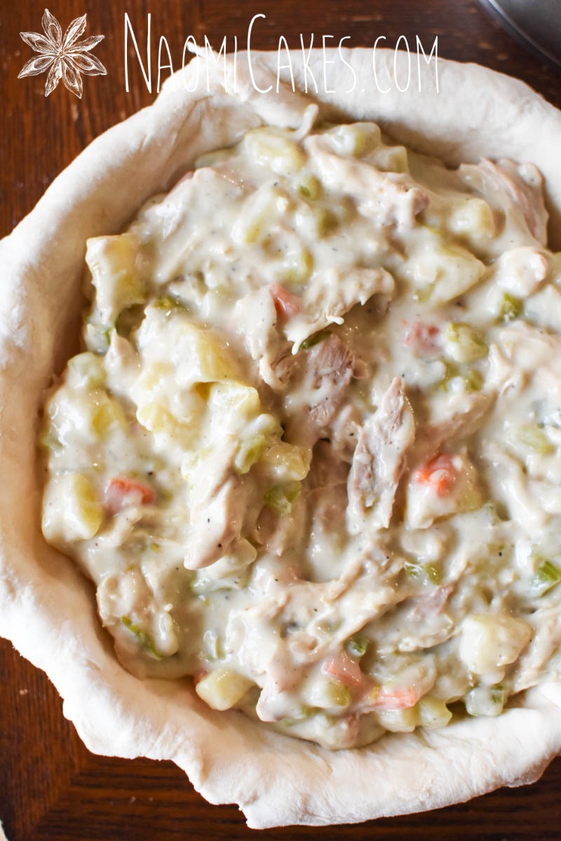 chicken pot pie filling inside a bottom crust