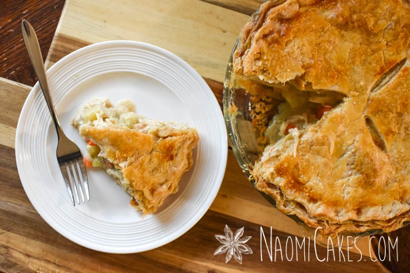 overhead view of a slice of chicken pie and the pie it came from