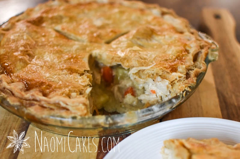 a chicken pot pie with a slice taken out of the plate