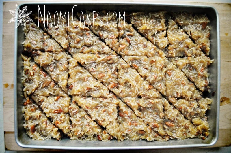 overhead view of a pan of German chocolate brownies cut into 24 triangles