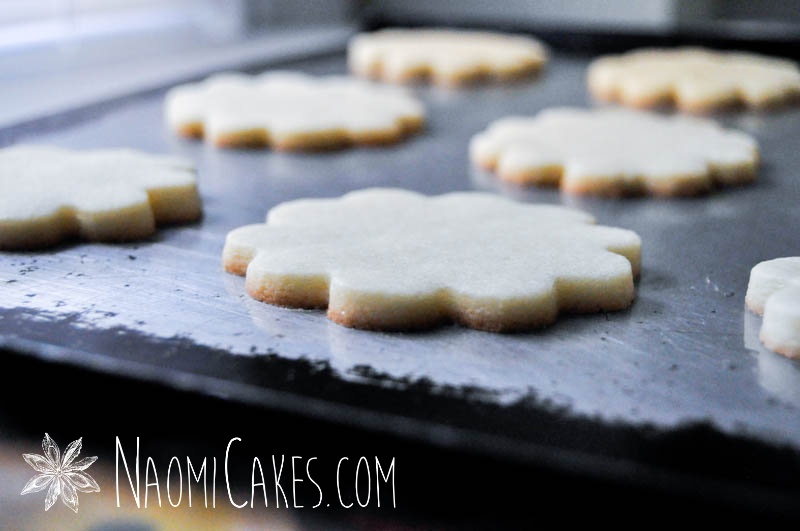 baked flower shaped sugar cookies on a pan