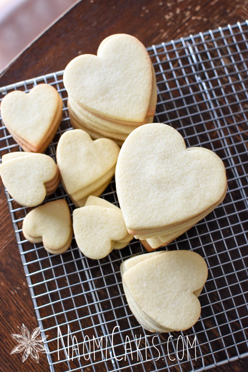 heart shaped sugar cookies on a cooling rack