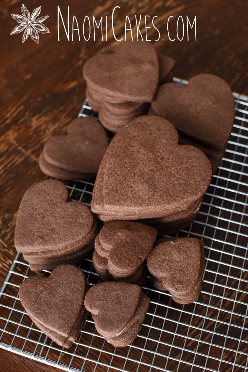 chocolate heart shaped cookies on a cooling rack