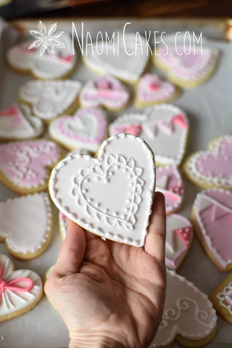 pink and white lace decorated heart cookie for Valentines Day