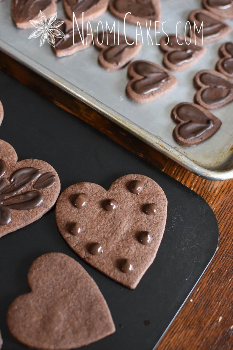 chocolate heart shaped sugar cookies with chocolate decoration dots