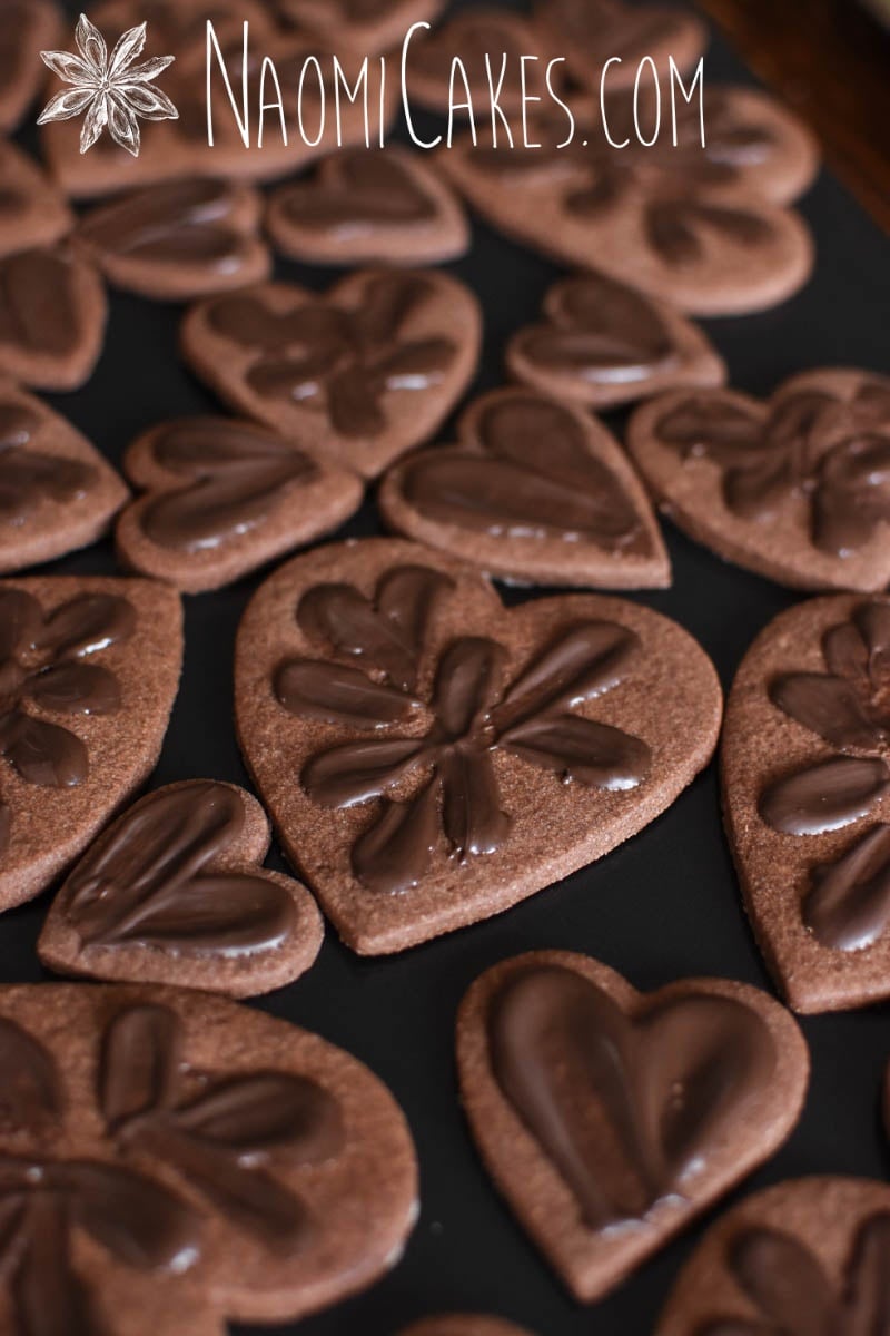 chocolate heart shaped sugar cookies with chocolate smeared on top