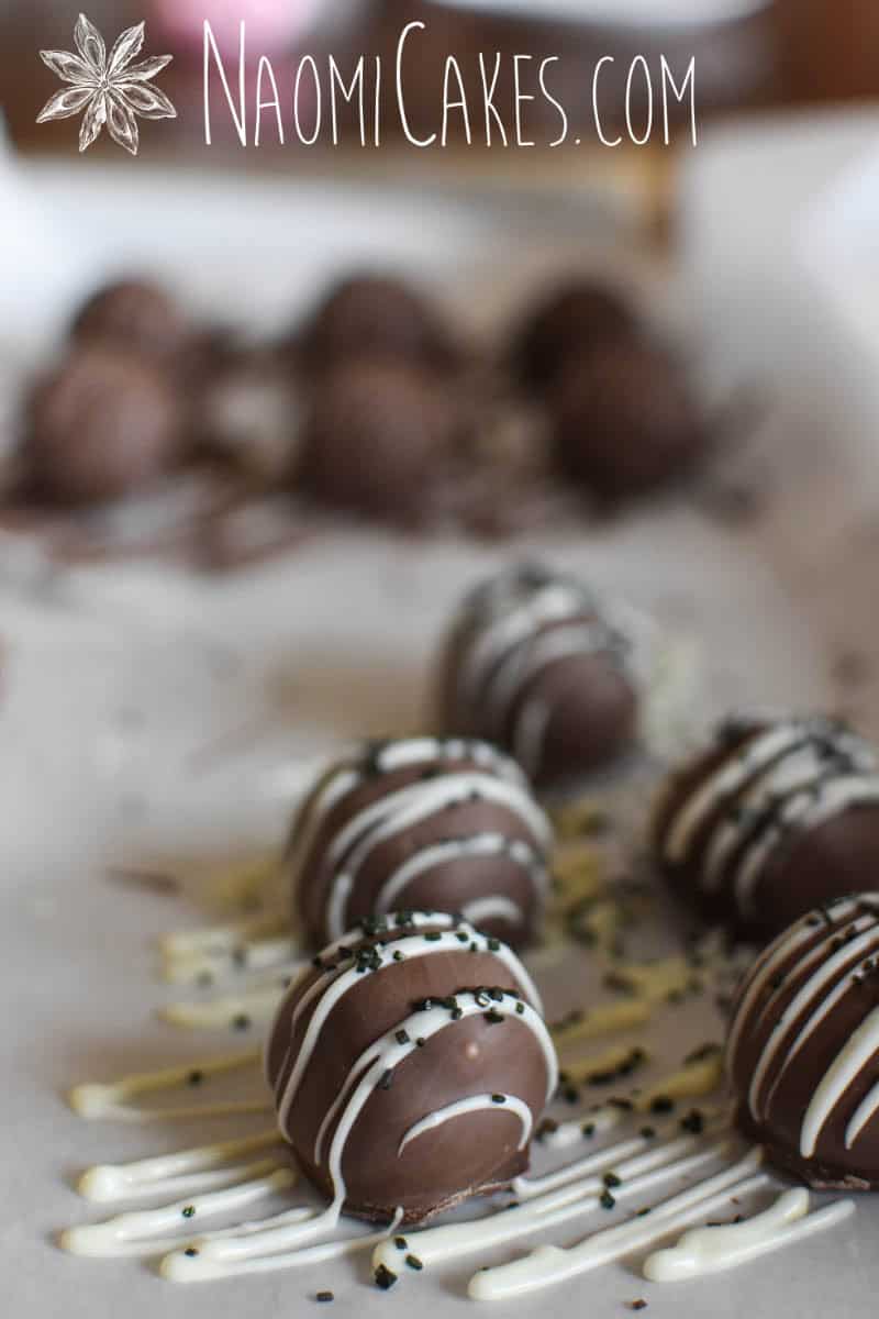 white chocolate drizzled milk chocolate truffles with black sugar
