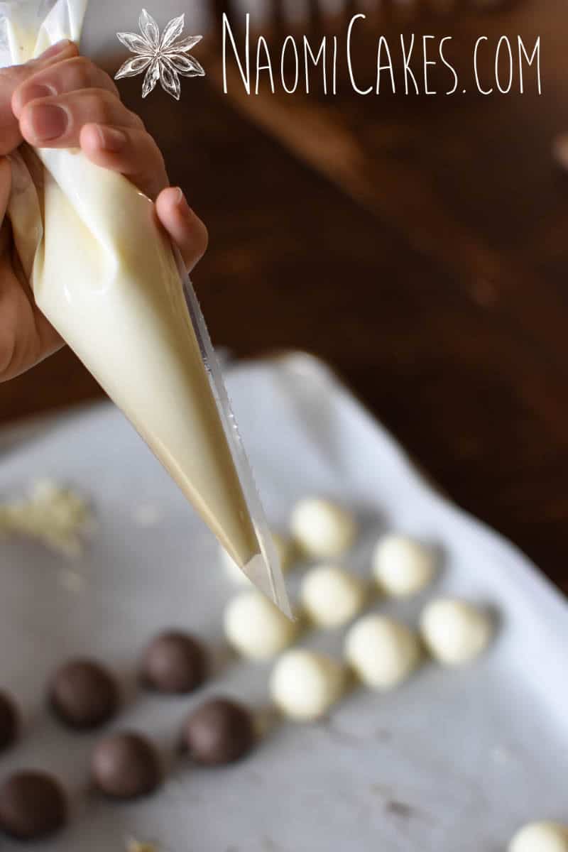 bag of melted white chocolate with truffles in the background