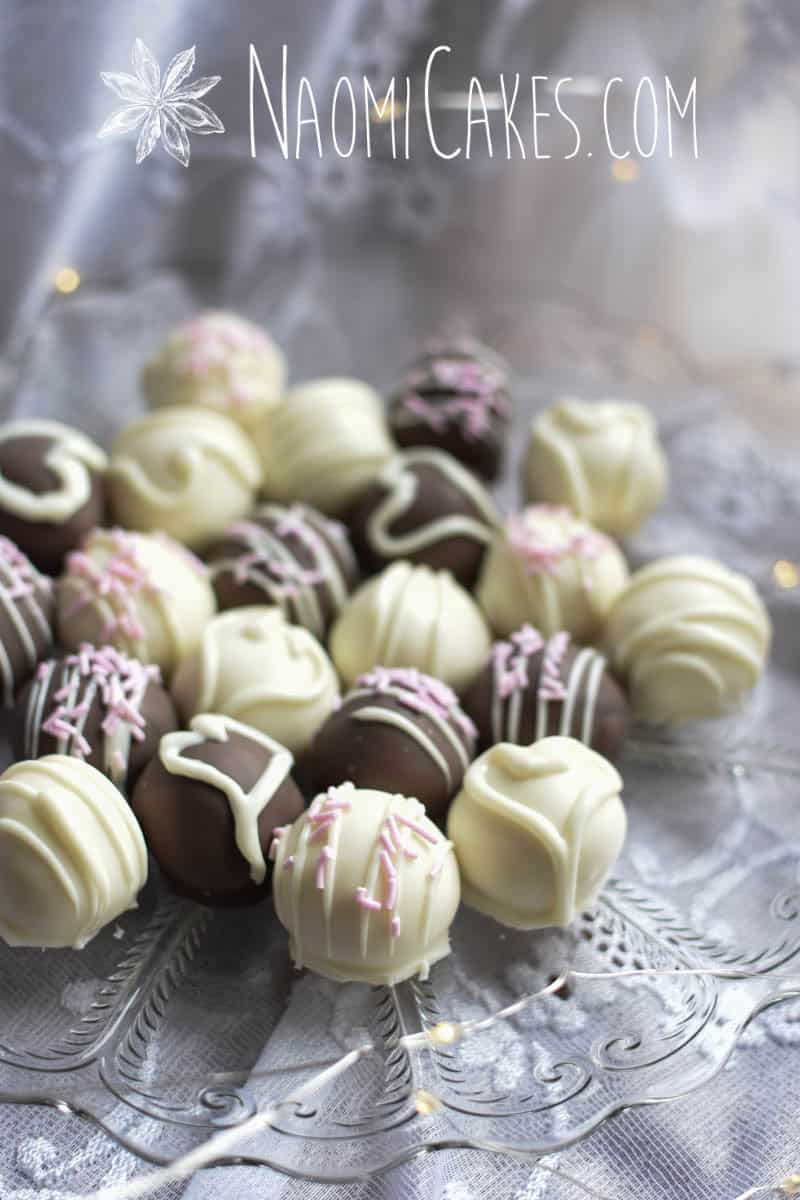 plate of assorted homemade white chocolate truffles on lace with lights
