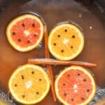 pot of apple cider with mulling spices