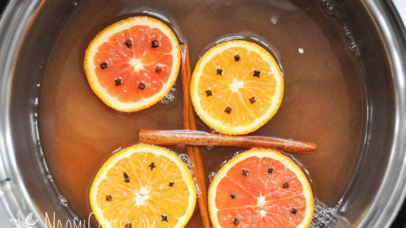 pot of apple cider with mulling spices