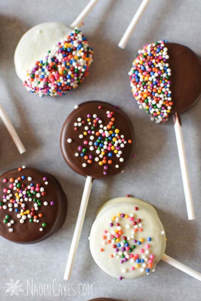 oreo lollipops with sprinkles on parchment