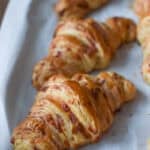Croissants on a baking sheet with cheese