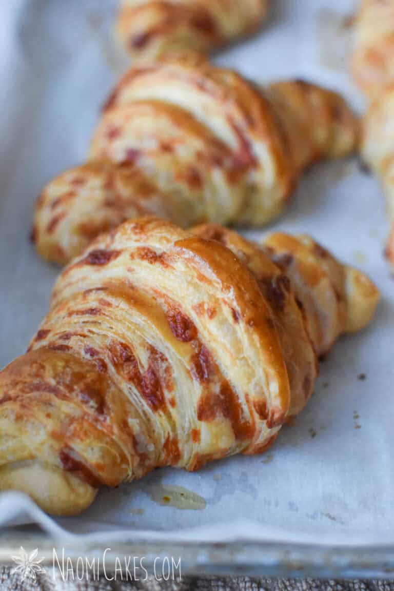 Cheesy croissants on a baking sheet