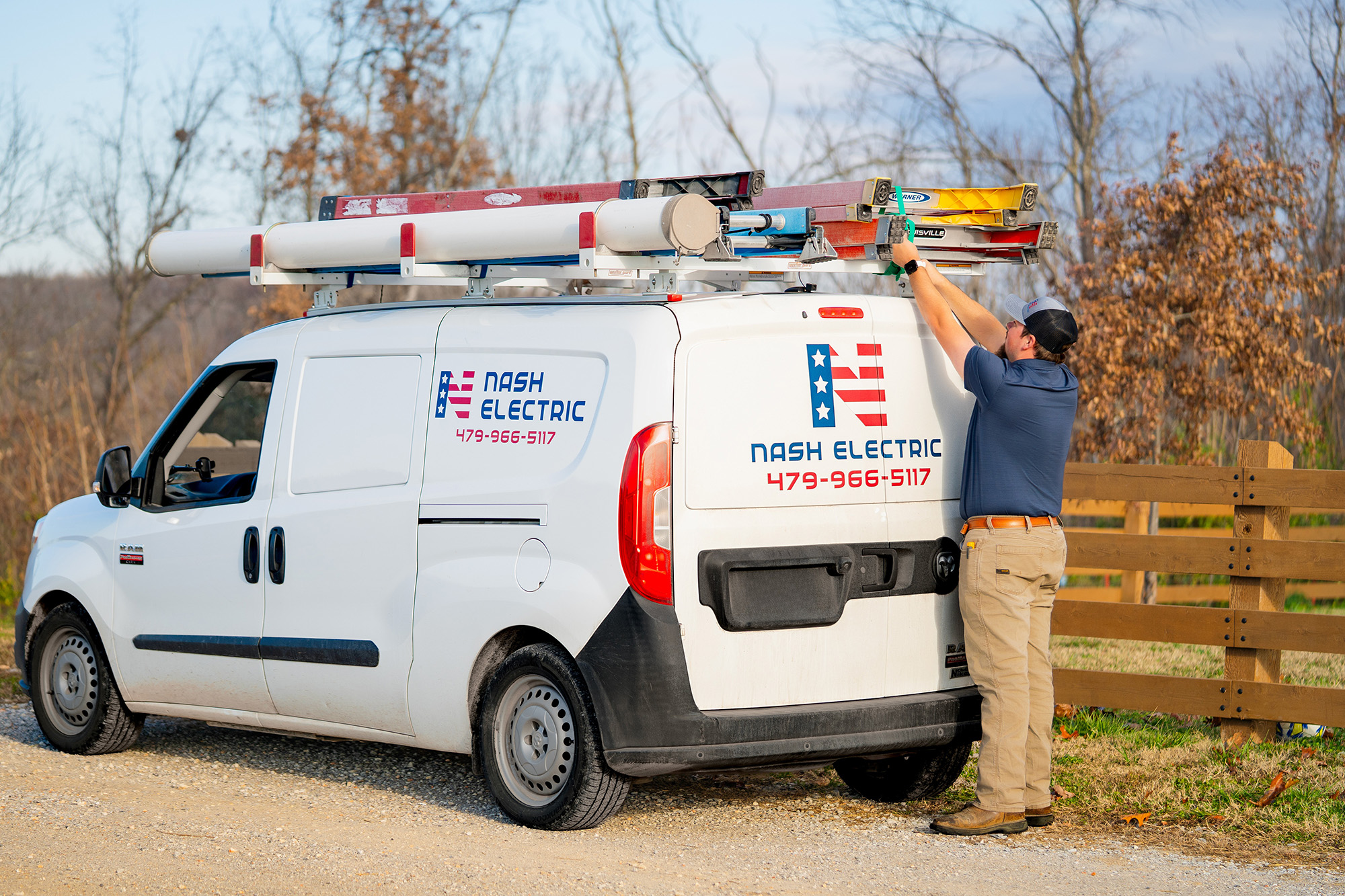 Nash Electric white van with a technician loading the van.