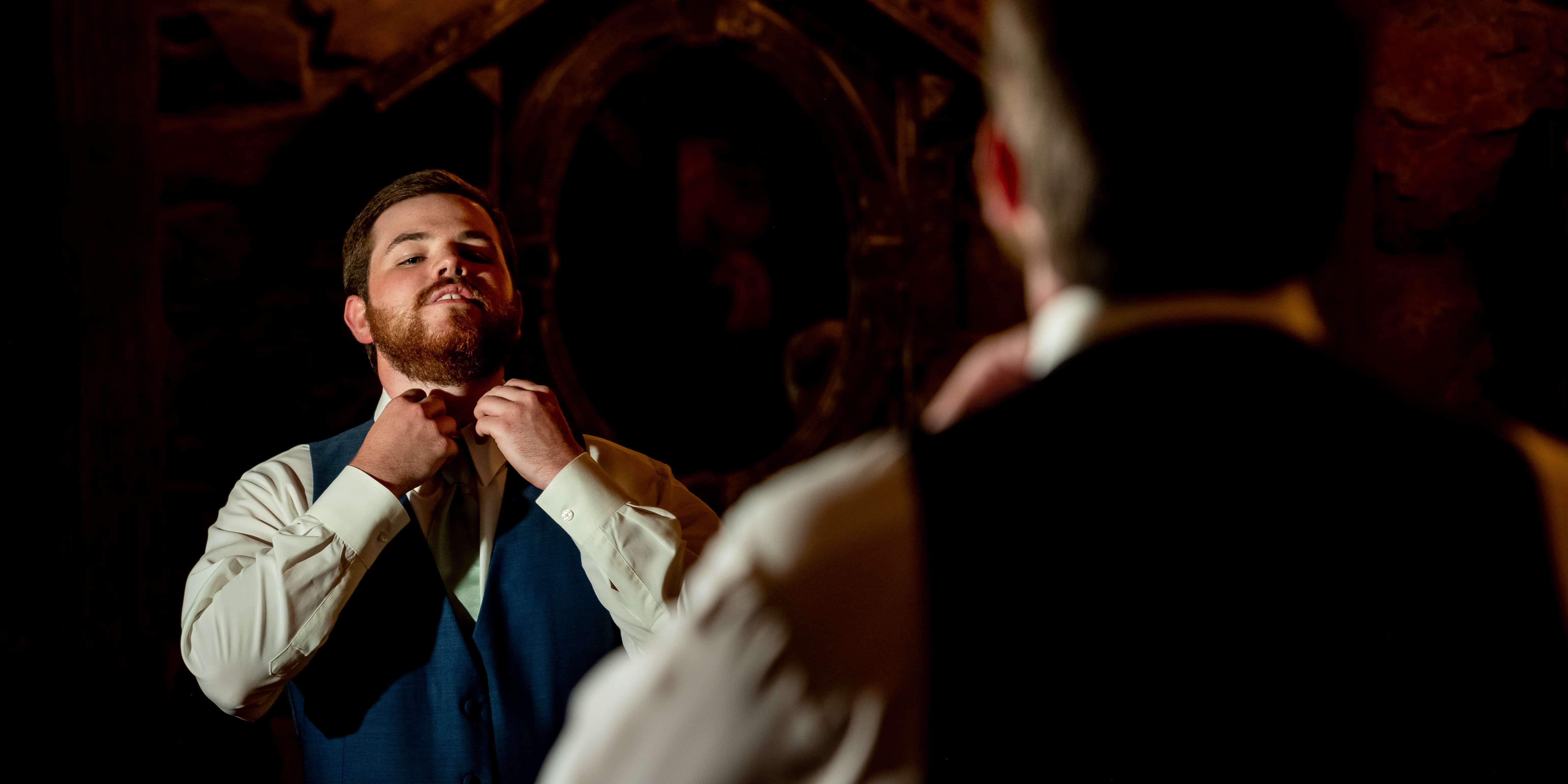 groom fixing bowtie