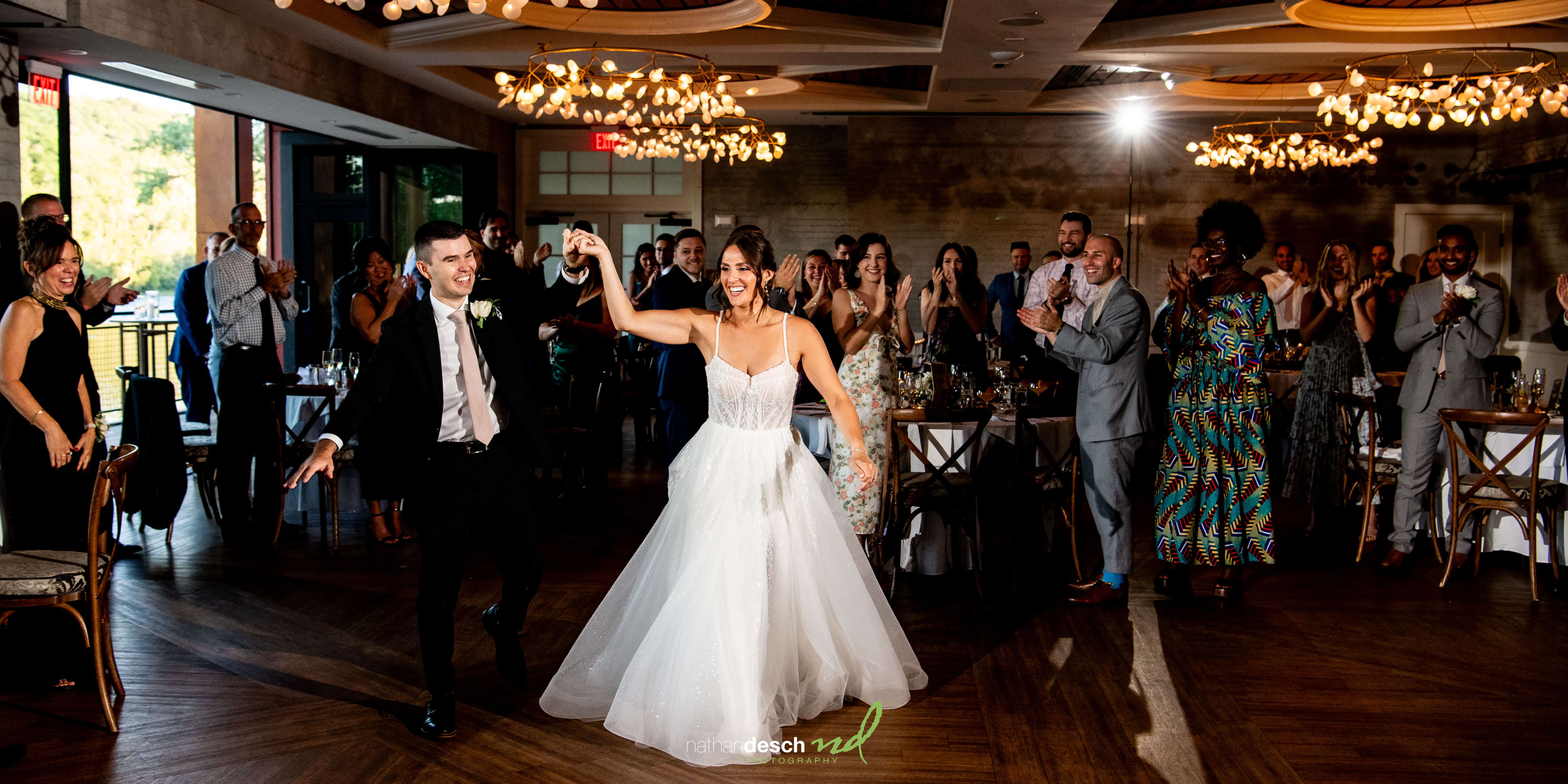 bride and groom intros at river house at odettes 