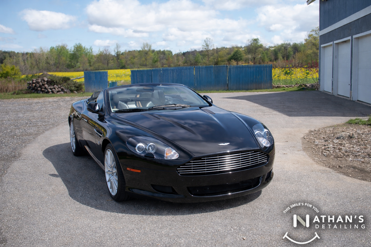Black aston martin convertible cleaned during mobile detailing