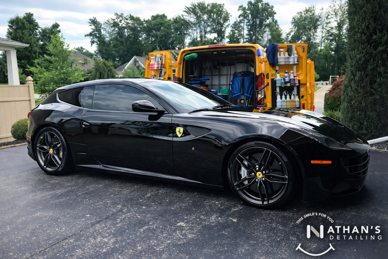 Black ferrari coupe with detail van setup during mobile detailing