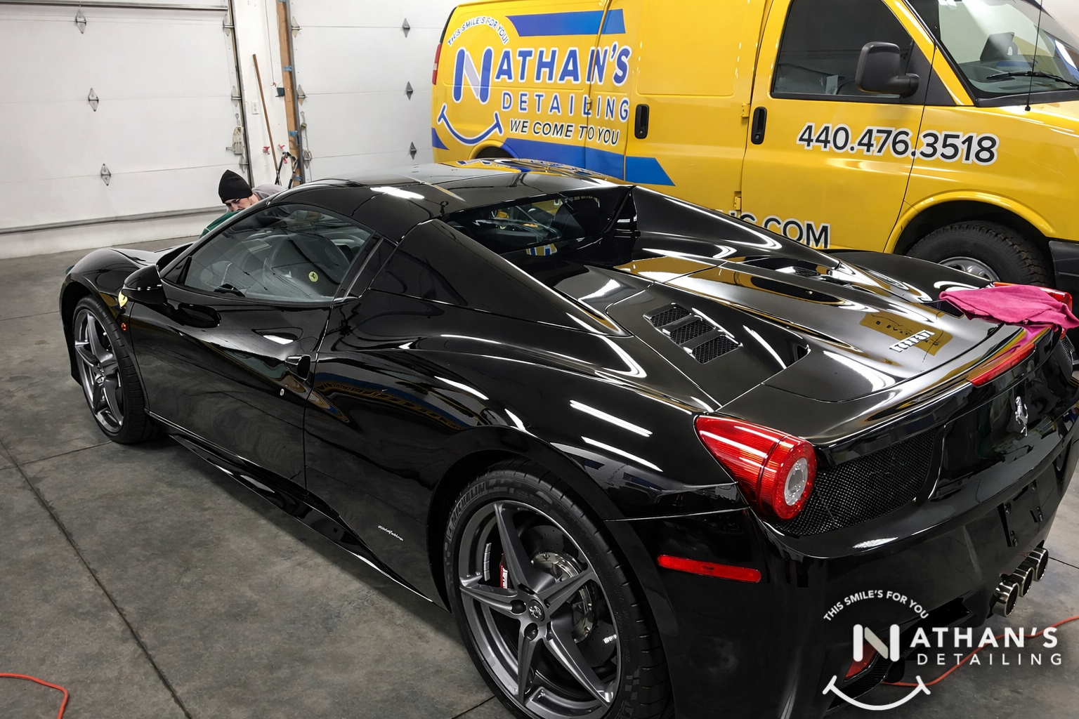 Black ferrari polished in garage during mobile detailing