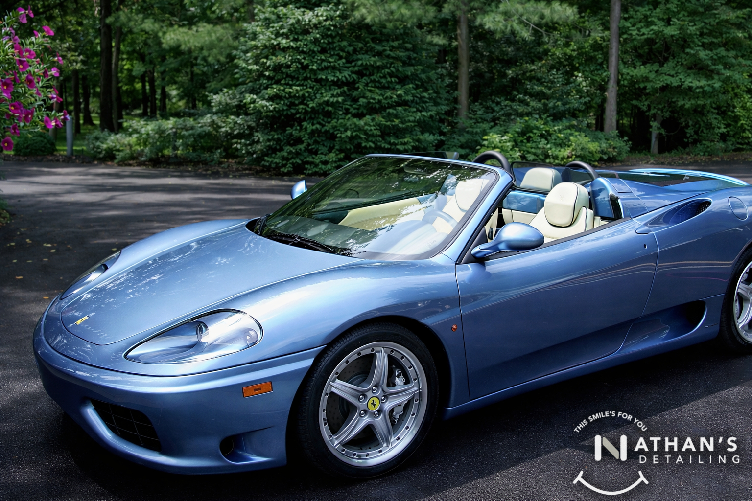 Blue ferrari convertible cleaned top down during mobile detailing in Lakewood