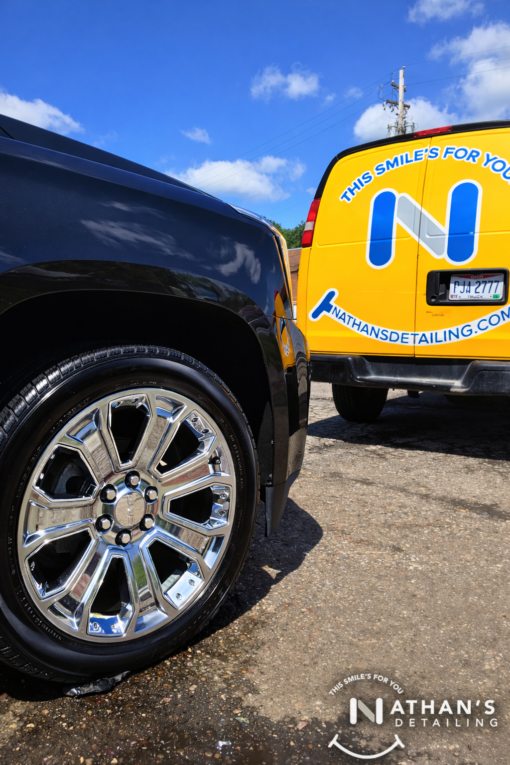 Chrome wheel closeup with detail van during mobile detailing