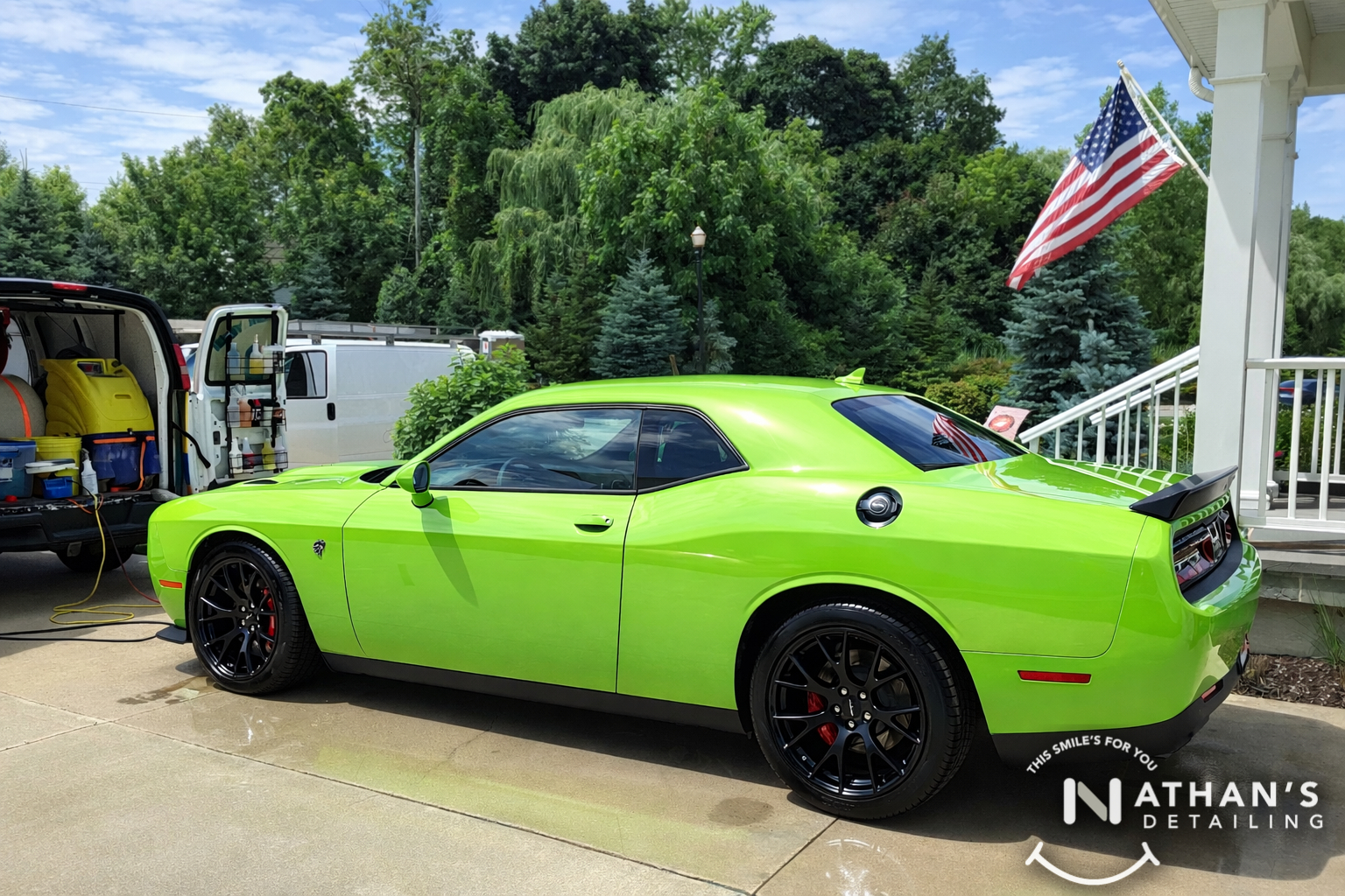 Green challenger next to mobile detail setup during mobile detailing