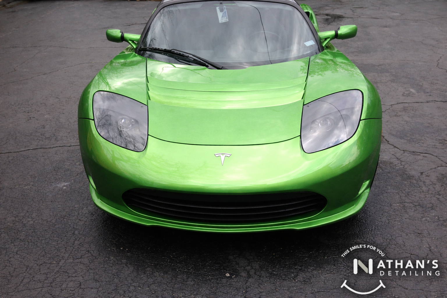 Green roadster front end clean shine during mobile detailing