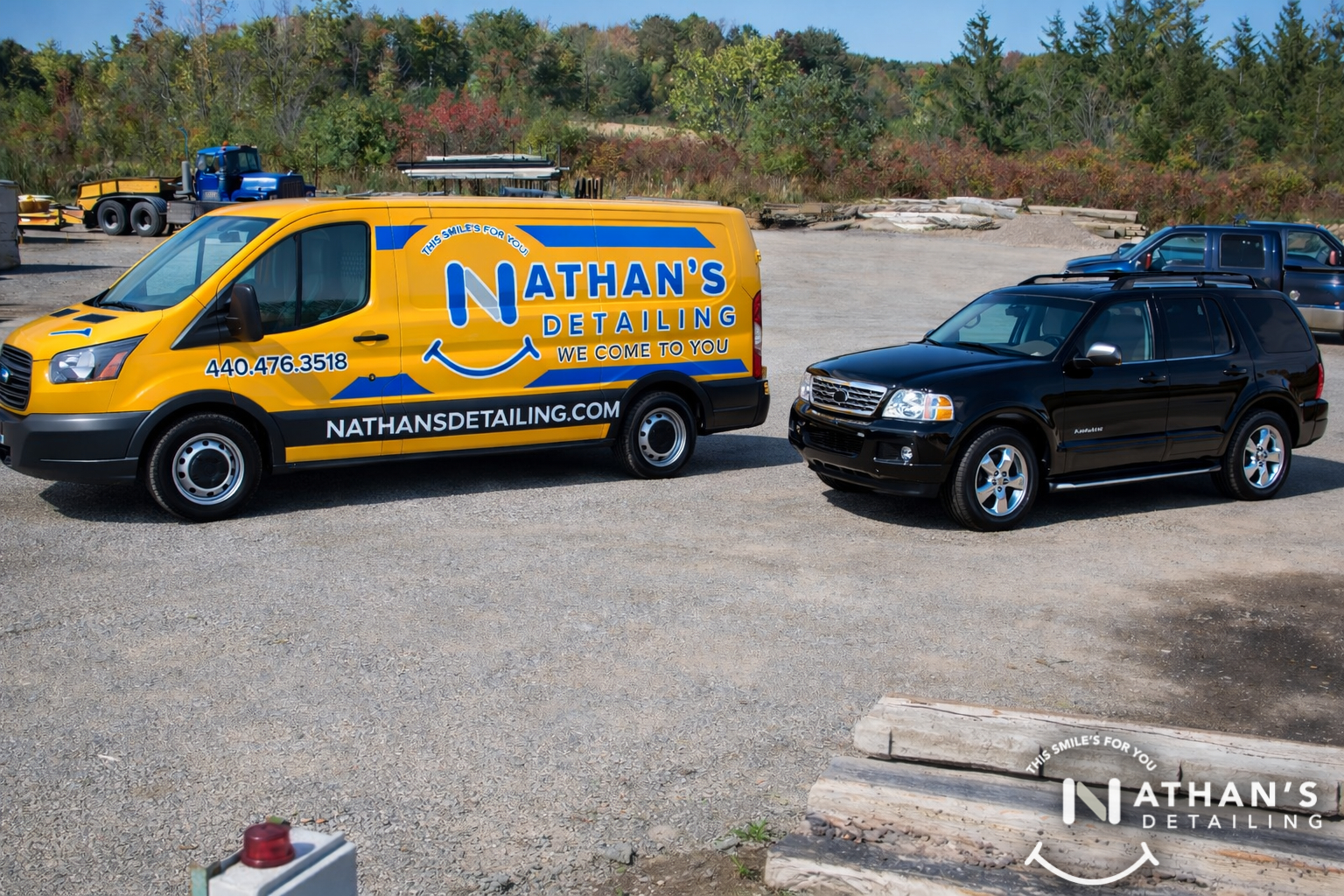 Mobile detailing van next to black suv