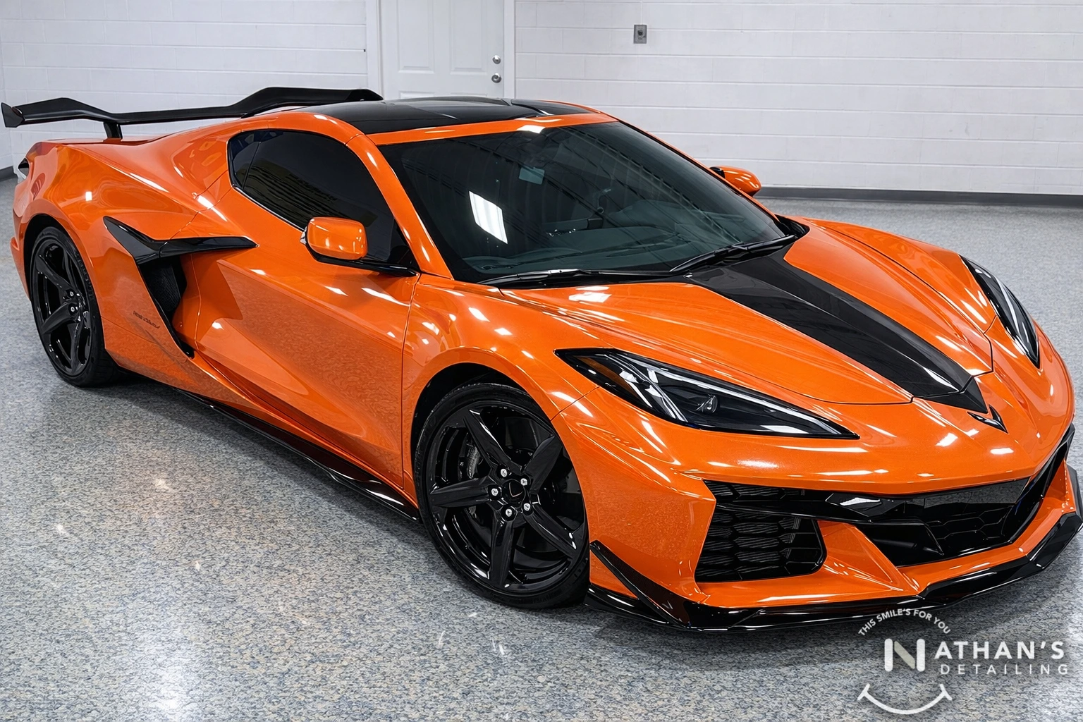 Orange Corvette in our studio after paint protection film installation.