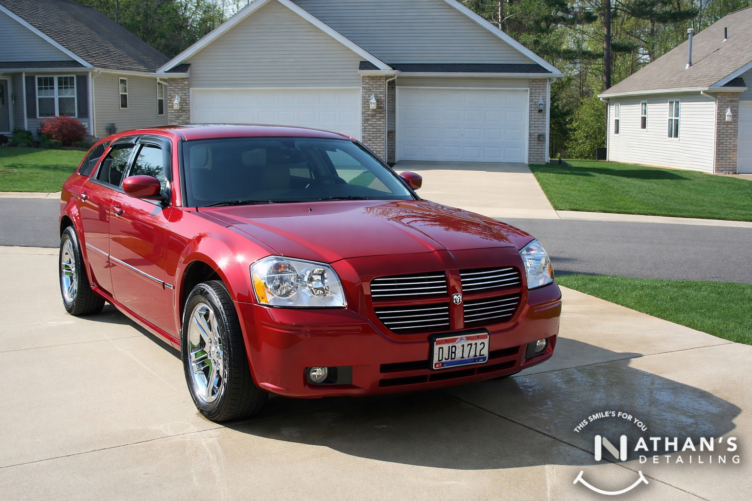 Red wagon clean finish driveway during mobile detailing