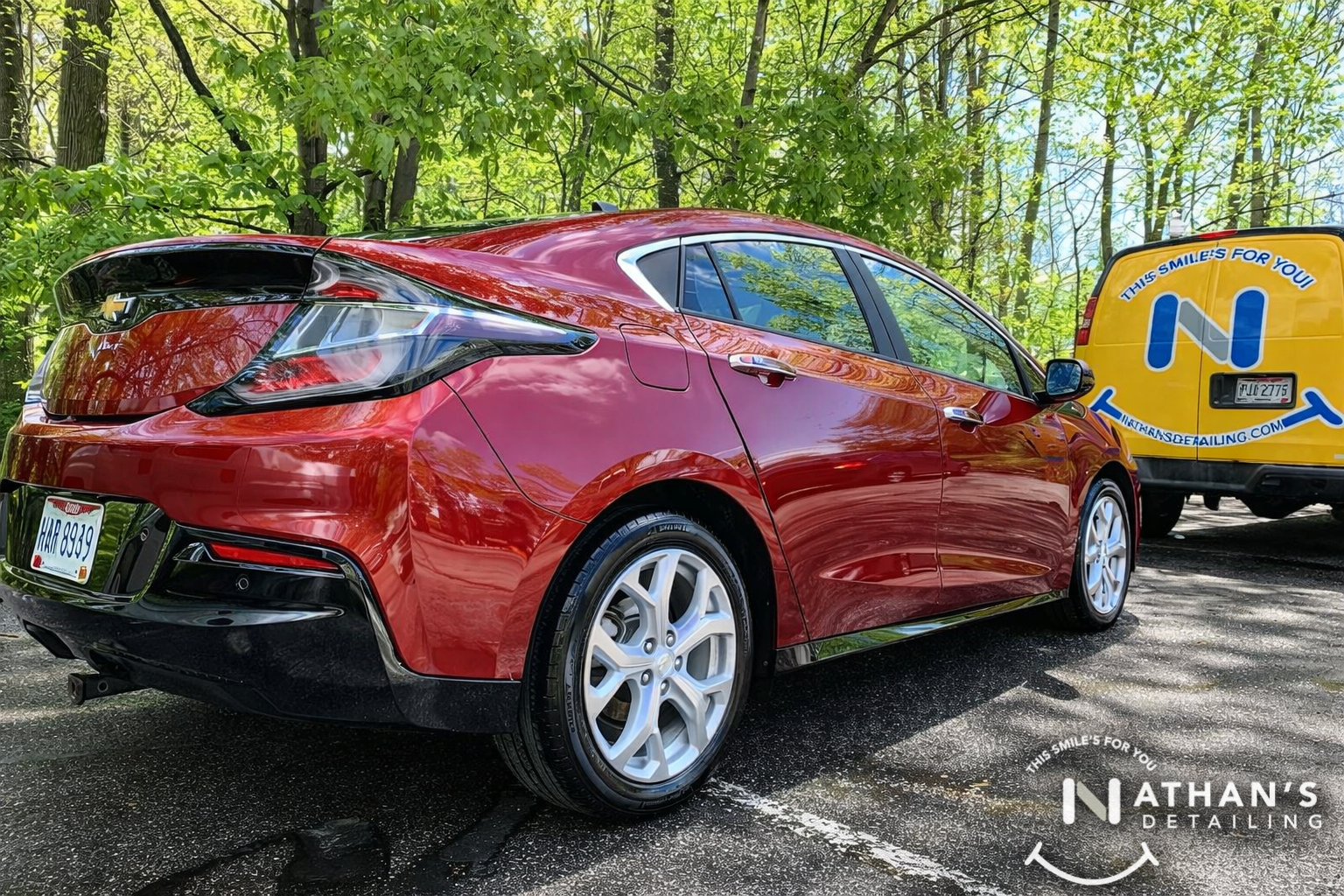 Shiny red hatchback after exterior detail during mobile detailing in Canton