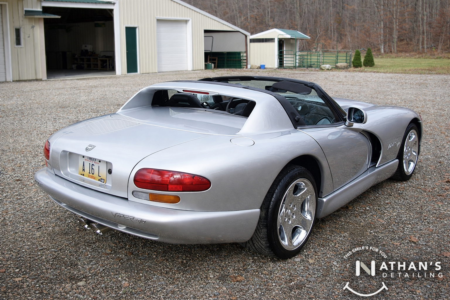 Silver convertible clean finish rear angle during mobile detailing