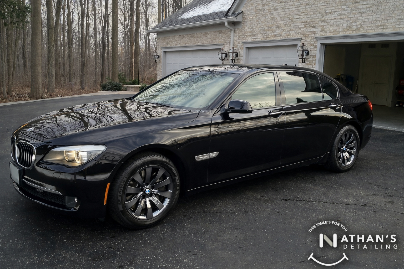 Black bmw sedan driveway detail finish during mobile detailing