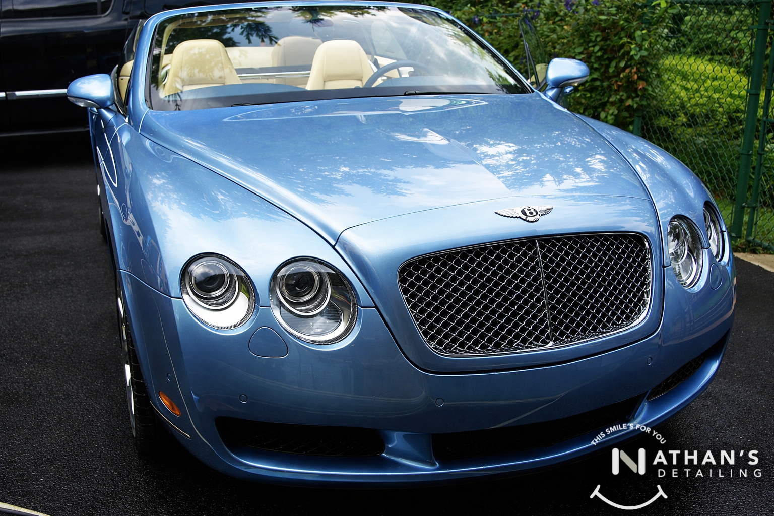 Blue bentley convertible clean front end during mobile detailing