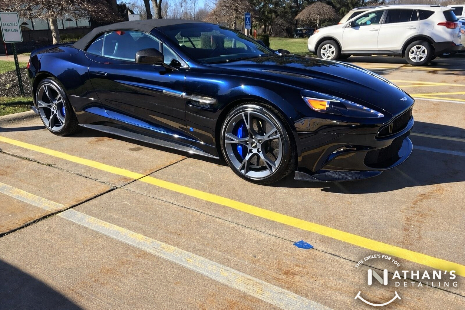 Blue convertible detailed in parking lot during mobile detailing in Aurora