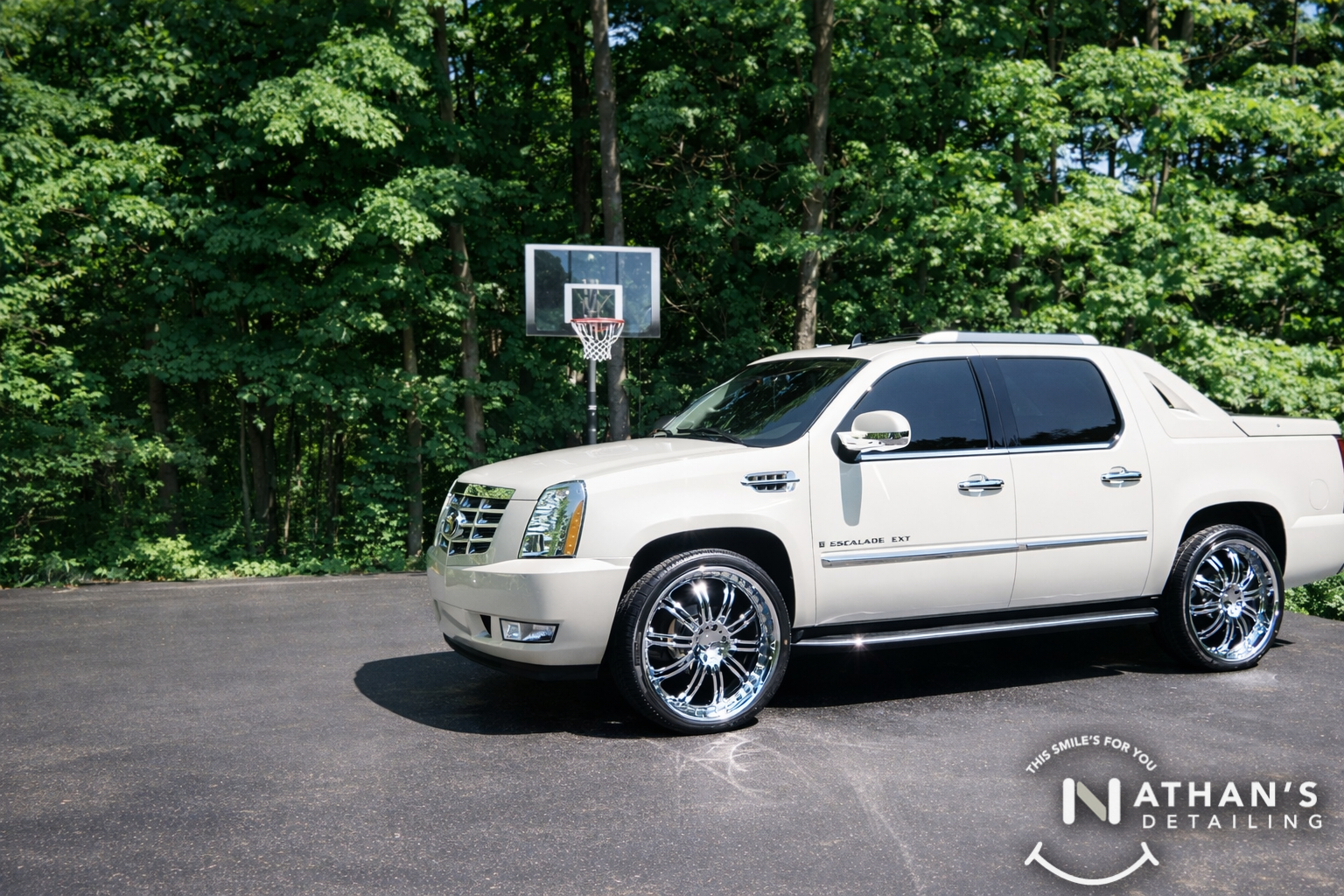Clean white suv with polished chrome wheels during mobile detailing in Twinsburg